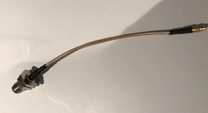 PT316-006I-MMCX-RTFBH: 6" In LMR 195 Cable Assembly with Bulkhead RP TNC-Female and MMCX Connectors